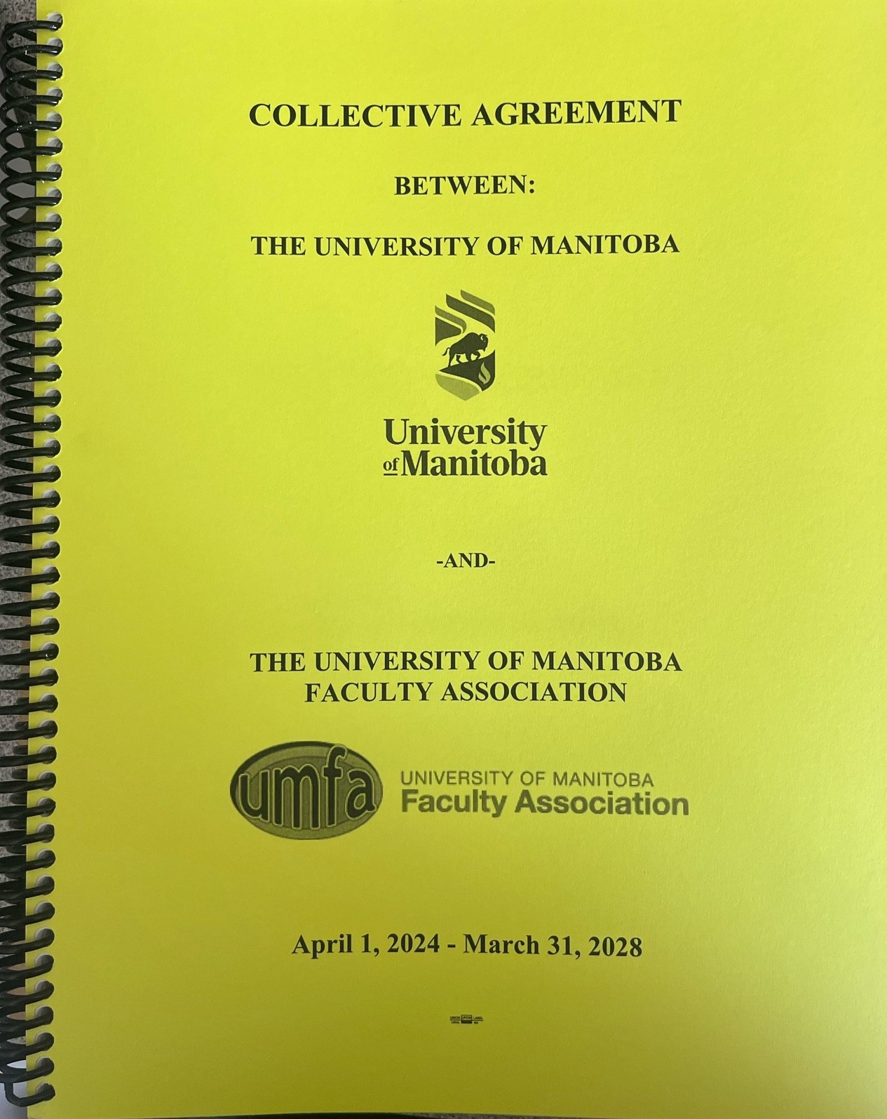 a photograph of the front cover of UMFA's Collective Agreement for 2024-2028